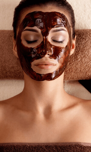 young-woman-relaxing-with-facial-mask-face-beauty-salon-indoor (1)